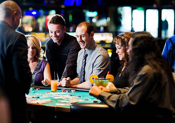 Live Caribbean Stud Poker dealer at okta138 table with cards displayed